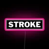 Neon sign with pink color scheme illuminating a stroke seat in bold RGB lights.