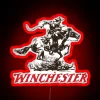 Neon sign reading 'Stuff and Colt' in bold, RGB-lit letters with a red glow.