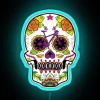 Colorful sugar skull decoration with neon lights, inspired by Dia de los Muertos celebrations.