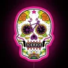 Neon sugar skull decoration with vibrant pink and green hues, symbolizing Dia de los Muertos.