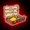 A colorful suitcase in front of a vibrant neon sign with summer vibes.