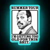 Neon sign with humorous phrase about getting older, featuring bright blue colors and summer tour theme.