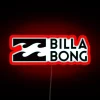 Billabong short sleeve clothing with neon accents in a summer setting.