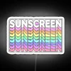 Neon neon sign reading "SUNSCREEN" in bold white letters against a bright RGB background.