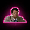 Neon pink sign with supernatural theme in RGB colors.