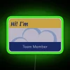 Neon green nametag with bold font on a superstore's employee ID badge.