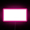 Colorful neon sign supporting local music in vibrant pink hue, promoting community art scene.