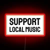 Neon sign in rainbow colors promoting support for local music