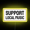 Neon sign promoting support for local music with colorful RGB lighting.