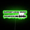 Colorful neon sign reading 'Support Local Music' in vibrant green letters.