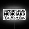 Supporting local musicians by buying them a beer at a vibrant, neon-lit venue.