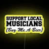 Supporting local musicians, buying someone a beer in a vibrant neon-lit atmosphere.