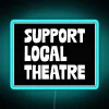 Neon sign with the words 'Support Local Theatre' in bold blue letters on a dark background.