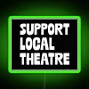 Neon sign supporting local theatre with vibrant green colors