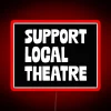 Supporting local theatre with vibrant neon lights in a bustling cityscape.