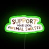 Supporting local animal shelters with bright, neon signage.