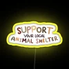 Neon sign reading 'Support Your Local Animal Shelter'