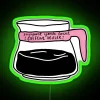 Neon sign reading 'Support Your Local Caffeine Dealer' with a vibrant green glow.