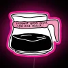 Neon sign reading 'Support Your Local Caffeine Dealer' in bright pink letters.
