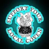 Neon sign reading 'Support Your Local Coven' in vibrant colors, with a blue glow effect.