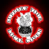 Neon sign reading 'Support Your Local Coven' in bold, colorful letters.