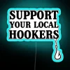 Neon sign reading 'Support Your Local Hookers Fishermen' in bold, colorful letters.