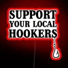 Colorful RGB neon sign reading 'Support Your Local Hookers Fishermen'