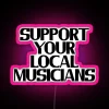 Neon sign supporting local musicians with a pink background and RGB colors.