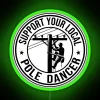 A neon sign with RGB colors reading "Support Your Local Pole Dancer Electrician Power Lineman" in green.