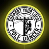 Neon sign with colorful letters spelling out support for local pole dancers, electricians, and power linemen in a vibrant...