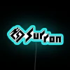 Neon sign reading Sur Ron 2 in blue font against a white background.