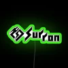 Neon sign with green glow reading Sur Ron 2 in white letters.