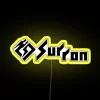 Neon sign with yellow letters reading 'Sur Ron 2'