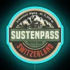 Neon sign advertising Susten Pass in Switzerland at sunset