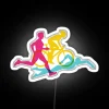RGB neon sign featuring the swim, bike, and run icons of a triathlon.