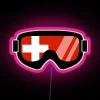 Neon-colored Swiss goggles with a flag pattern on a pink background, inspired by Disney's Dopey art.