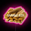 Neon tamale sign in vibrant pink hues.