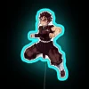 Tanjiro Kamado from Demon Slayer holding a neon sign with his name in blue.