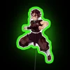 Tanjiro Kamado from Kimetsu no Yaiba standing in front of an RGB neon sign with a green glow.