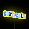 Neon Tar Heels sign in a bright yellow color scheme against a dark background