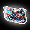 Neon sports bike with vibrant teal and orange LED strip on a white background.