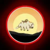 Group of diverse colleagues gathered around an RGB neon sign with a team avatar on Appa, showcasing unity and digital coll...