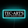 RGB Neon Sign with blue accents on a black background.