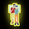 Teenage boy Shin Chan and Kazama standing in front of an RGB neon sign.