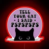 Cat owner's humorous message displayed on a car bumper in neon RGB colors.