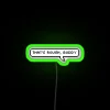 Neon sign with RGB display reading 'That's Rough, Buddy'