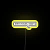 Neon sign with bold, colorful letters reading 'That's Rough Buddy'