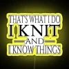 Neon sign with bold, colorful letters reading "I knit and I know things" in a futuristic style.