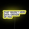 RGB neon sign with yellow letters spelling out a data-related criticism