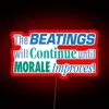 Neon sign with red letters reading "The beatings will continue until morale improves